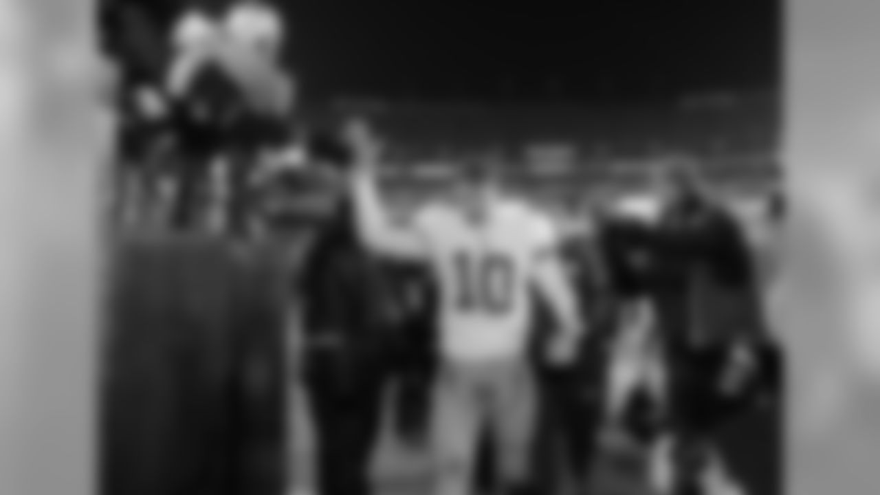New York Giants quarterback Eli Manning walks off the field after the NFL football game against the Washington Redskins, Monday, Dec. 21, 2009, in Landover, Md. The New York Giants won 45 - 12. (AP Photo/Alex Brandon)