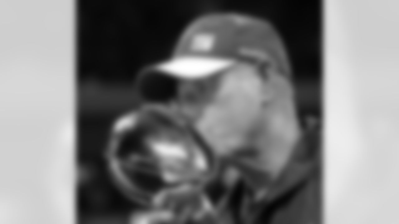 New York Giants head coach Tom Coughlin kisses the Vince Lombardi Trophy after his team's 21-17 win over the New England Patriots in the NFL Super Bowl XLVI football game, Sunday, Feb. 5, 2012, in Indianapolis. (AP Photo/David J. Phillip)