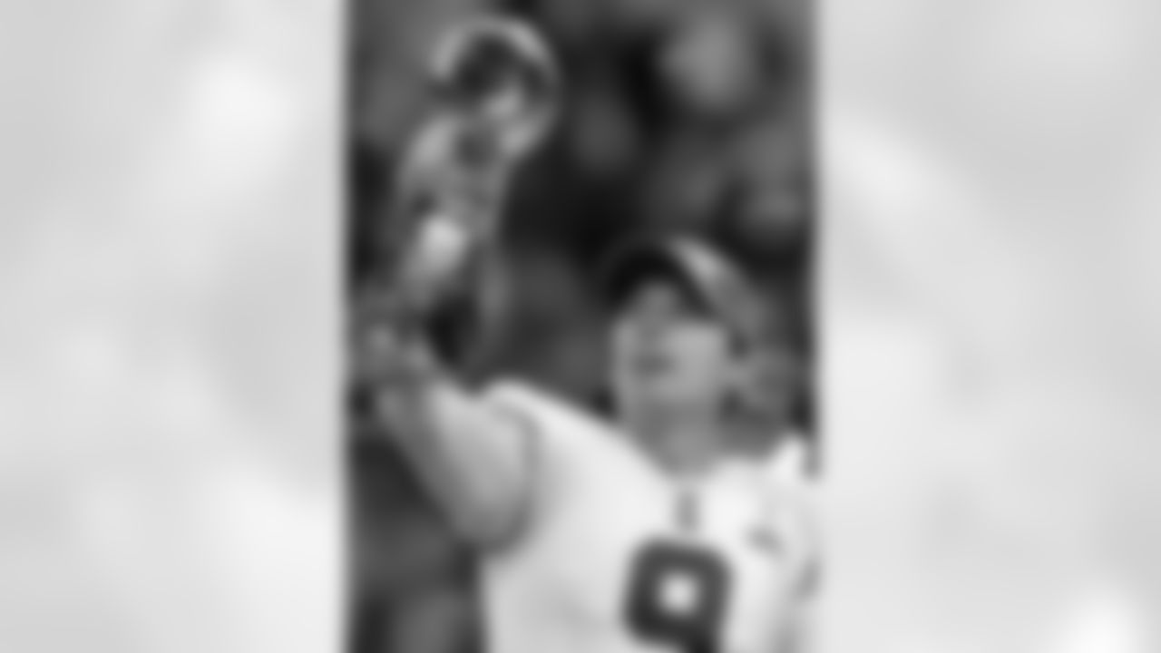 New York Giants kicker Lawrence Tynes holds up the Vince Lombardi Trophy after the Giants' 21-17 win in the NFL Super Bowl XLVI football game against the New England Patriots, Sunday, Feb. 5, 2012, in Indianapolis. (AP Photo/Chris O'Meara)