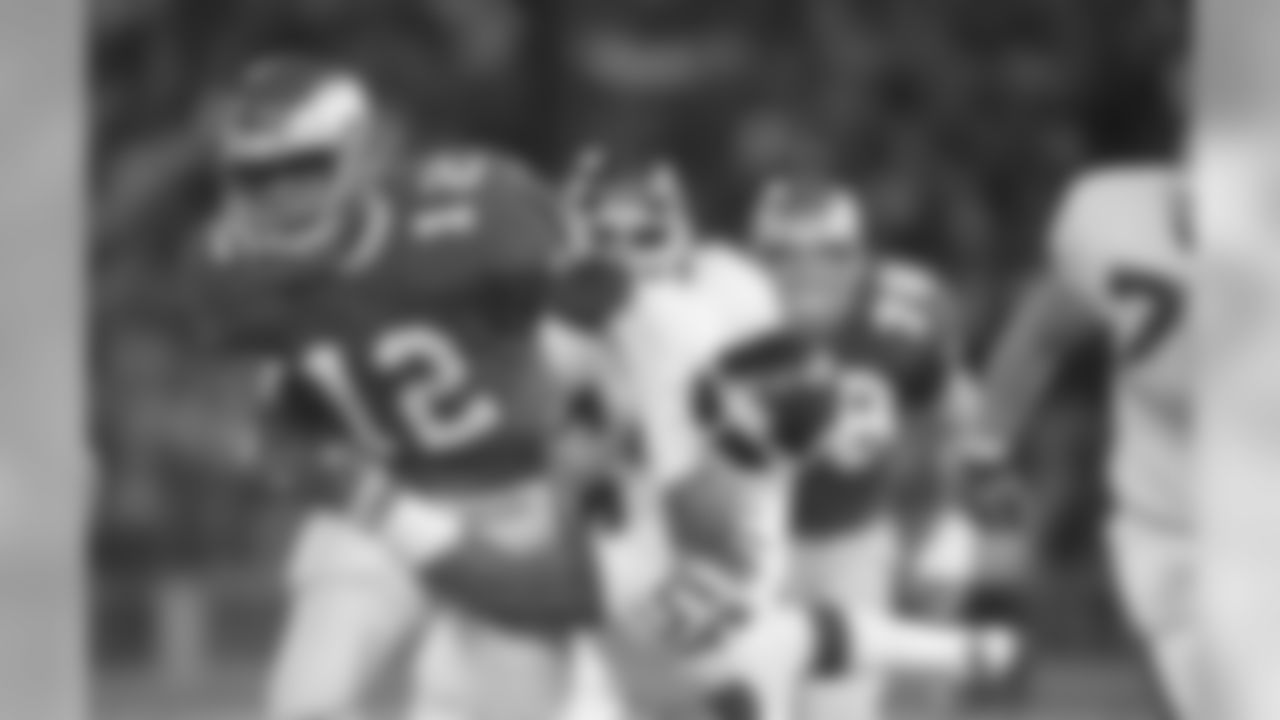 Philadelphia Eagles quarterback Randall Cunningham is tackled by New York Giants' Lawrence Taylor as he ran for a three yard gain in the fourth quarter of game at Veterans Stadium in Philadelphia on Sunday, Nov. 15, 1987. Taylor was injured on the play and helped off the field. The Giants won the game, 20-17. (AP Photo/Peter Morgan)
