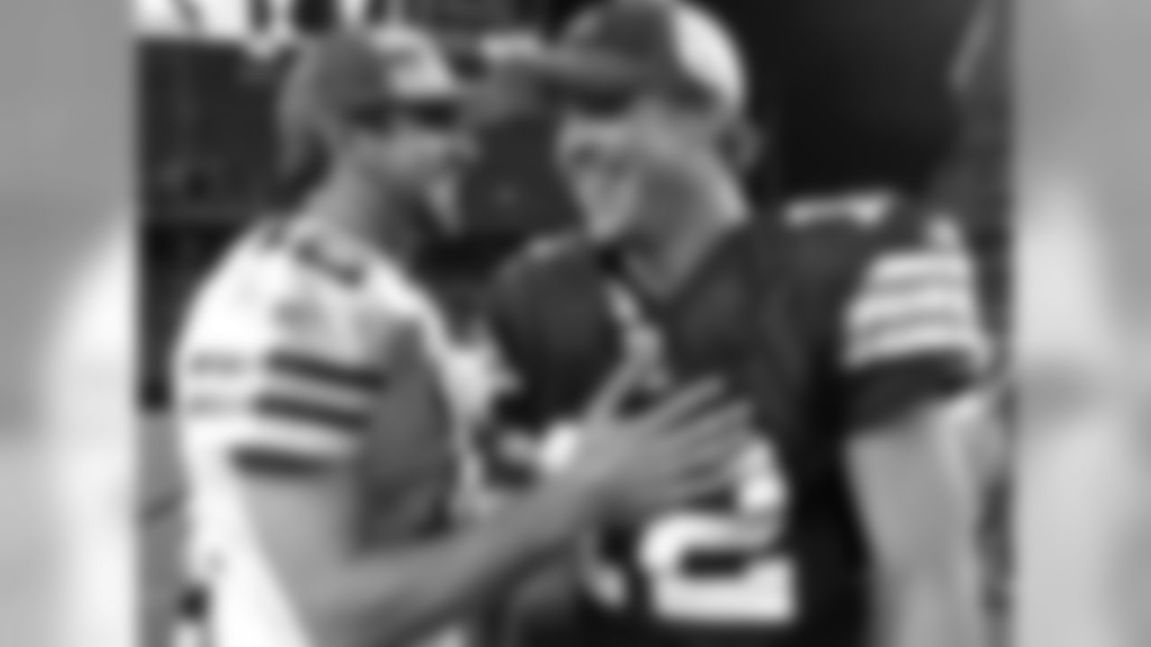 Cleveland Browns quarterback Colt McCoy, right, talks with Green Bay Packers quarterback Aaron Rodgers after the Browns beat the Packers 27-17 in an NFL preseason football game Saturday, Aug. 13, 2011, in Cleveland. (AP Photo/Tony Dejak)