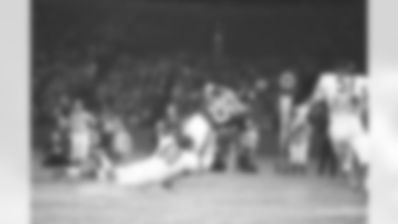 Wide receiver Don Hermann (85) of the New York Giants is pulled down by linebacker Lee Roy Caffey (60) of the Chicago Bears in first quarter action in New York, Sept. 19, 1970. The Bears won, 24-13. (AP Photo/Ron Frehm)