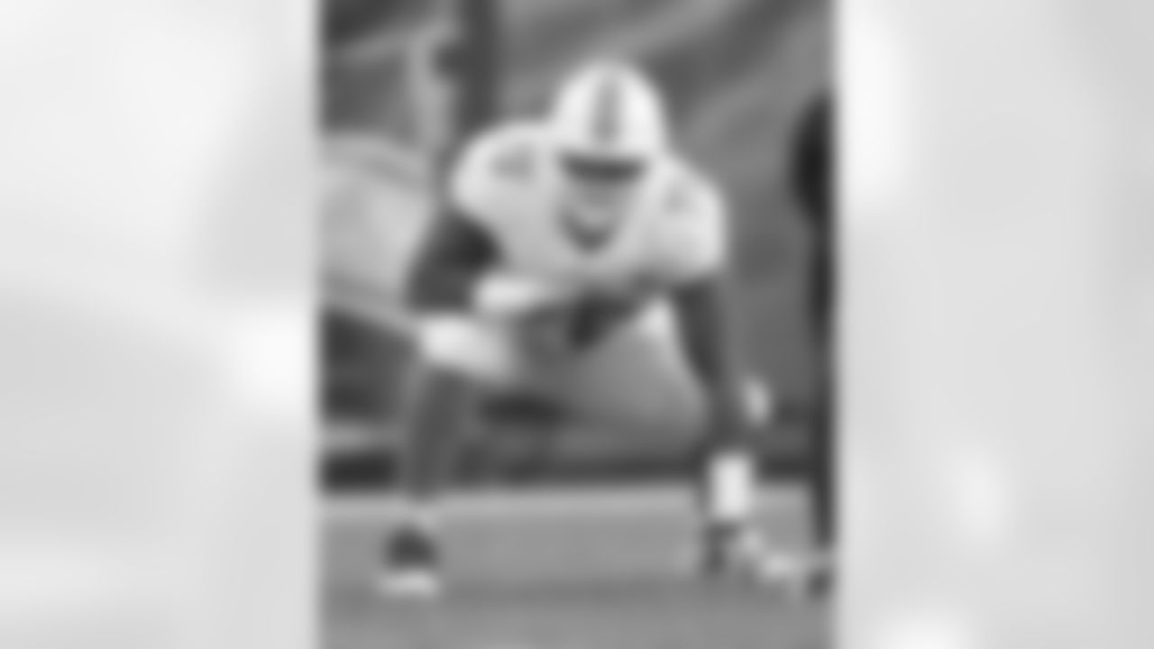 Miami Dolphins guard Jamil Douglas (75) lines up in a three-point stance during an NFL game against the San Diego Chargers on December 20, 2015. The Chargers defeated the Dolphins 30-14. (Kevin Terrell via AP)