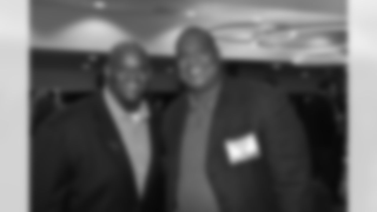 Robert Harris (right) pictured at the Giants' homecoming dinner. Harris played along the Giants' defensive line from 1995 to 1999.