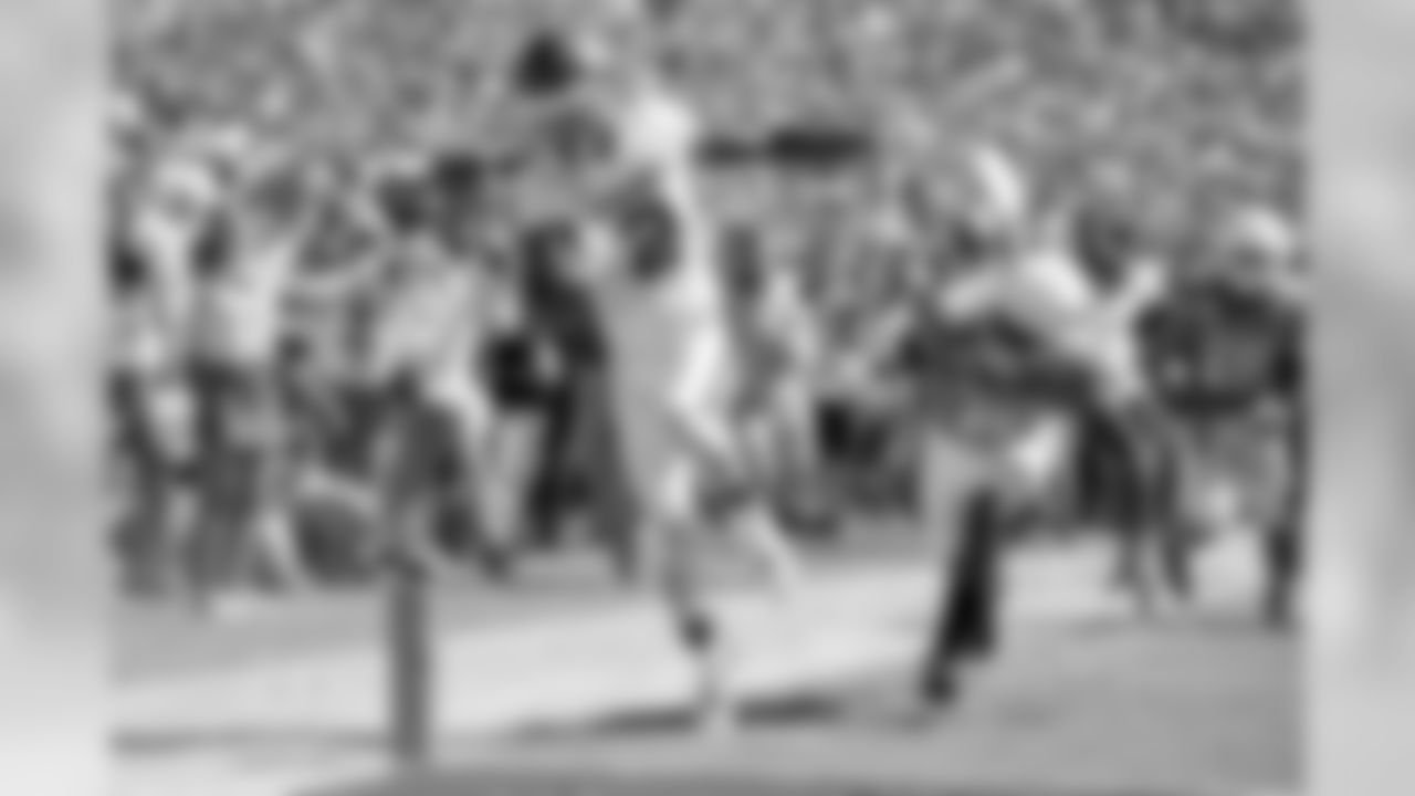 Oklahoma wide receiver CeeDee Lamb (2) scores on his third touchdown reception of the game in front of Texas defensive back D'Shawn Jamison (5) in the second half of an NCAA college football game at the Cotton Bowl, Saturday, Oct. 12, 2019, in Dallas. Lamb finished the game with 171 receiving yards as Oklahoma won 34-27. (AP Photo/Jeffrey McWhorter)