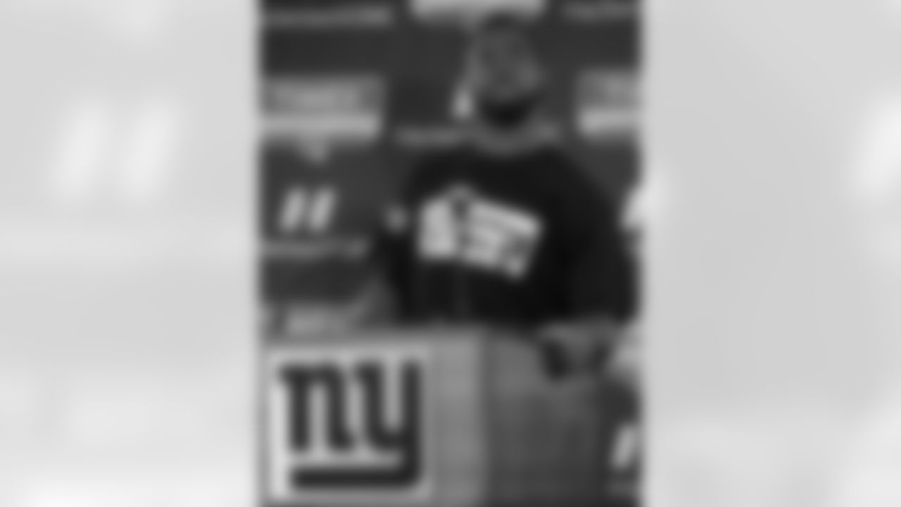 New York Giants defensive end Justin Tuck talks to the media during NFL football practice, Thursday, Jan. 12, 2012, in East Rutherford, N.J. The Giants travel to Green Bay to play the Packers in the playoffs on Jan. 15. (AP Photo/Julio Cortez)