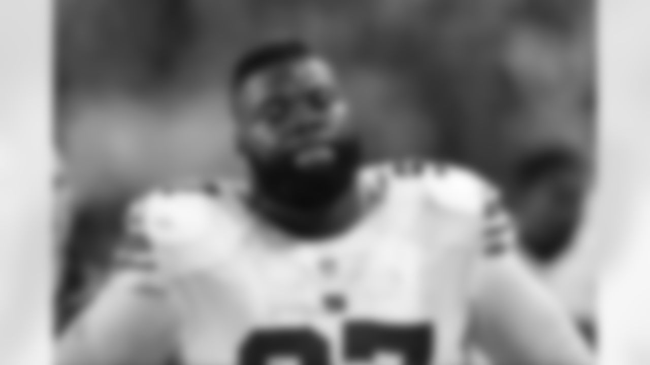 New York Giants defensive tackle Linval Joseph pauses near the end of an NFL football game against the Chicago Bears, Thursday, Oct. 10, 2013, in Chicago. The Bears won 27-21. (AP Photo/Charles Rex Arbogast)