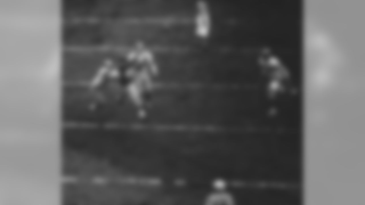 New York Giants halfback Kyle Rote catches a 22 yard pass from Charley Conerly, not shown, and carries Philadelphia Eagles Eddie Bell (81) into the end zone with him, to score the last Giants touchdown in the third period of their game Nov. 20, 1955 at the Polo Grounds in New York City. Other Eagles defenders are Linebacker Wayne Robinson (52) and Bob Hudson (42). The Giants won 31-7. (AP Photo/Harry Harris)