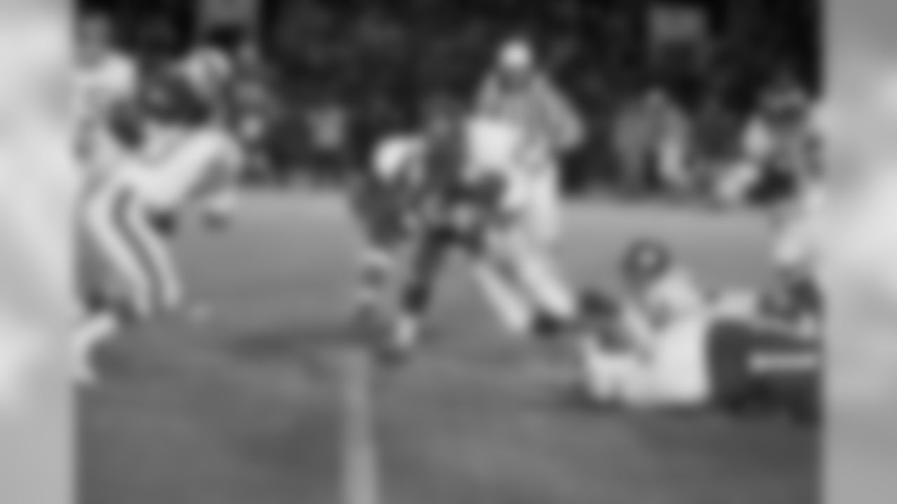 Lee Bouggess (46), Philadelphia Eagles running back is tackled by Bob Lurtsema (71) New York Giants defensive end while Giants linebacker Matt Hazeltine (64) hangs onto Bouggess' foot as Bouggess gained short yardage in first period of Giants - Eagle pro-football game in Philadelphia on Monday, Nov. 23, 1970. Eagles won, 23-20. (AP Photo/Bill Ingraham)