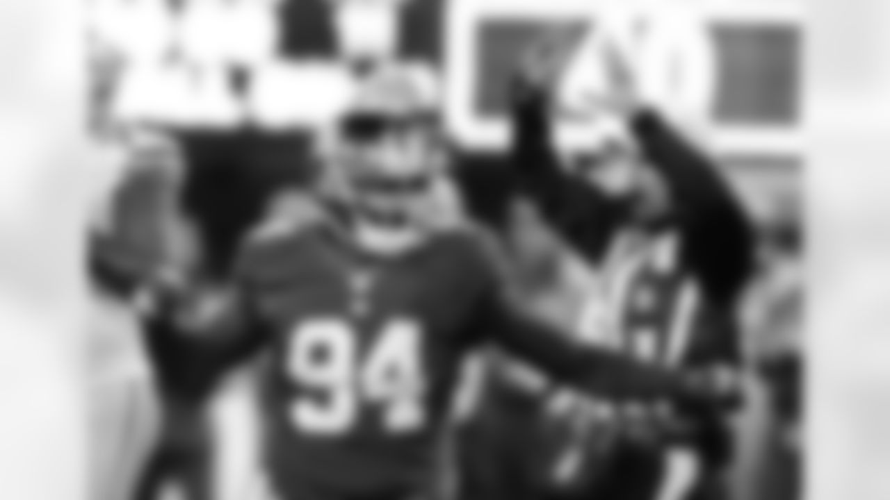 New York Giants linebacker Mathias Kiwanuka (94) celebrates a sack of Green Bay Packers' Aaron Rodgers during the second half of an NFL football game