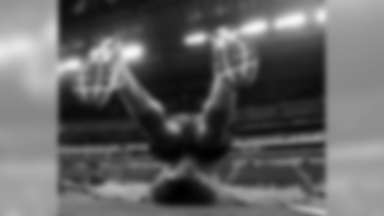 USC defensive lineman Leonard Williams stretches before drills at the NFL football scouting combine in Indianapolis, Sunday, Feb. 22, 2015. (AP Photo/Julio Cortez)