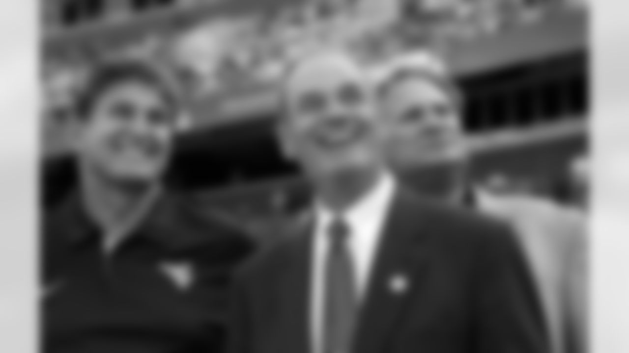 Sam Huff, center, Sen. Joe Manchin, D-W.Va., left, and others, watch a video tribute to Huff, as he was honored during a ceremony in the first half of an NCAA college football game between West Virginia and James Madison Saturday, Sept. 15, 2012, in Landover, Md. Huff played for West Virginia and went on to play in the the NFL for the New York Giants and the Washington Redskins. (AP Photo/Alex Brandon)