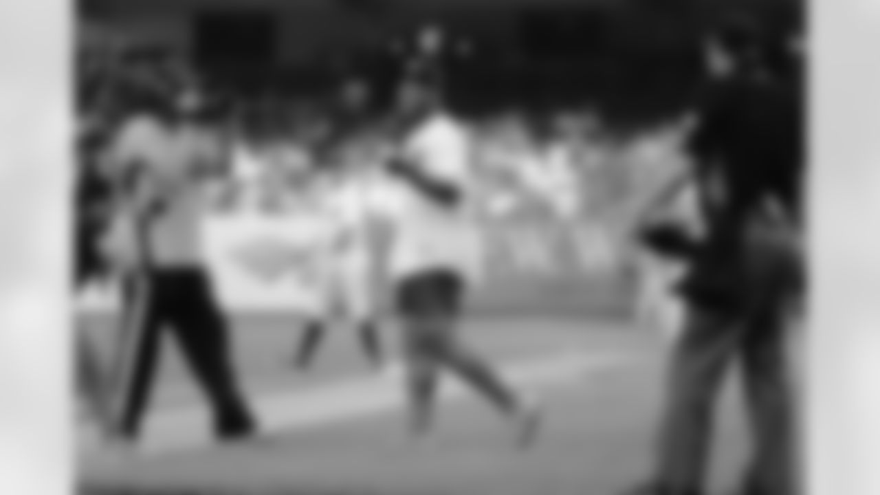 New York Giants running back Saquon Barkley heads to the pitcher's mound to throw out the ceremonial first pitch before a baseball game between the New York Yankees and the Houston Astros on Tuesday, May 29, 2018, in New York. (AP Photo/Frank Franklin II)