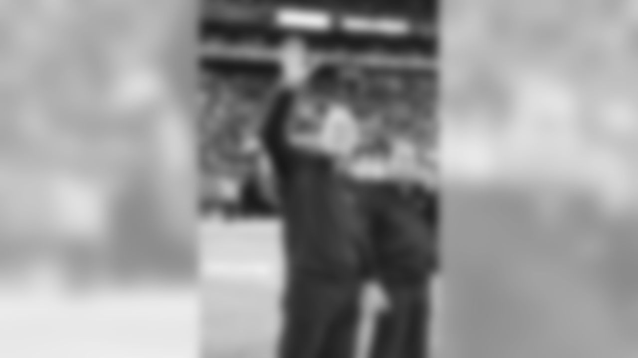 Bob Lurtsema waves to the crowd during the Giants' halftime celebration honoring Michael Strahan. Lurtsema played on the Giants' defensive line from 1967 to 1971.