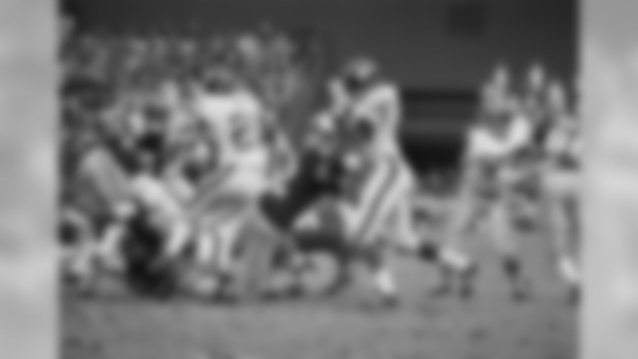 New York Giant tacklers converge on Redskins; Larry Brown after he picked up a good gain during game on Sunday, Dec. 5, 1971 in Washington. Giant tacklers are Ron Hornsby (67) and Scott Eaton (20). Brown gained 129 yards to help Washington defeat the Giants 23-7. (AP Photo/HWG)
