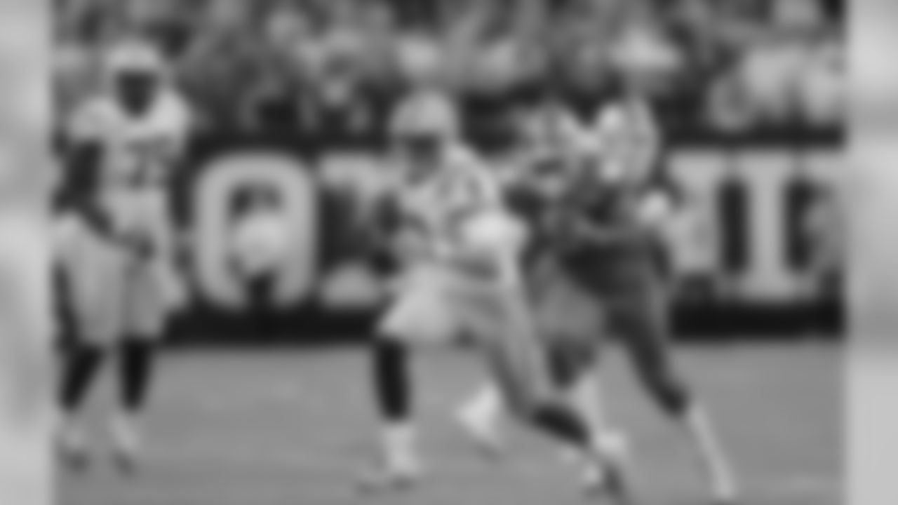 LSU quarterback Joe Burrow runs against Clemson during the first half of a NCAA College Football Playoff national championship game Monday, Jan. 13, 2020, in New Orleans. (AP Photo/Gerald Herbert)