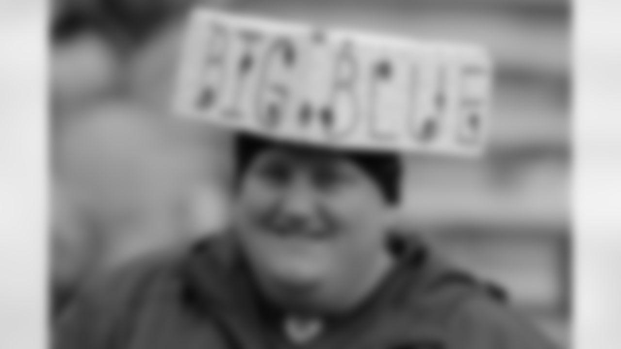 New York Giants fan is seen during the first half of an NFL divisional playoff football game between the Green Bay Packers and the New York Giants Sunday, Jan. 15, 2012, in Green Bay, Wis. (AP Photo/Darron Cummings)
