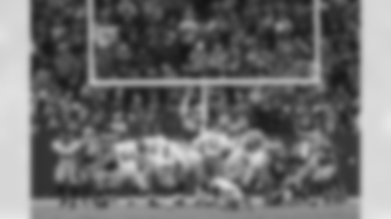 New York Giants kicker Lawrence Tynes (9) kicks an extra point at the end of the first half during an NFL divisional playoff football game against the Green Bay Packers on January 15, 2012 in Green Bay, Wisconsin. The Giants won 37-20. (AP Photo/David Stluka)