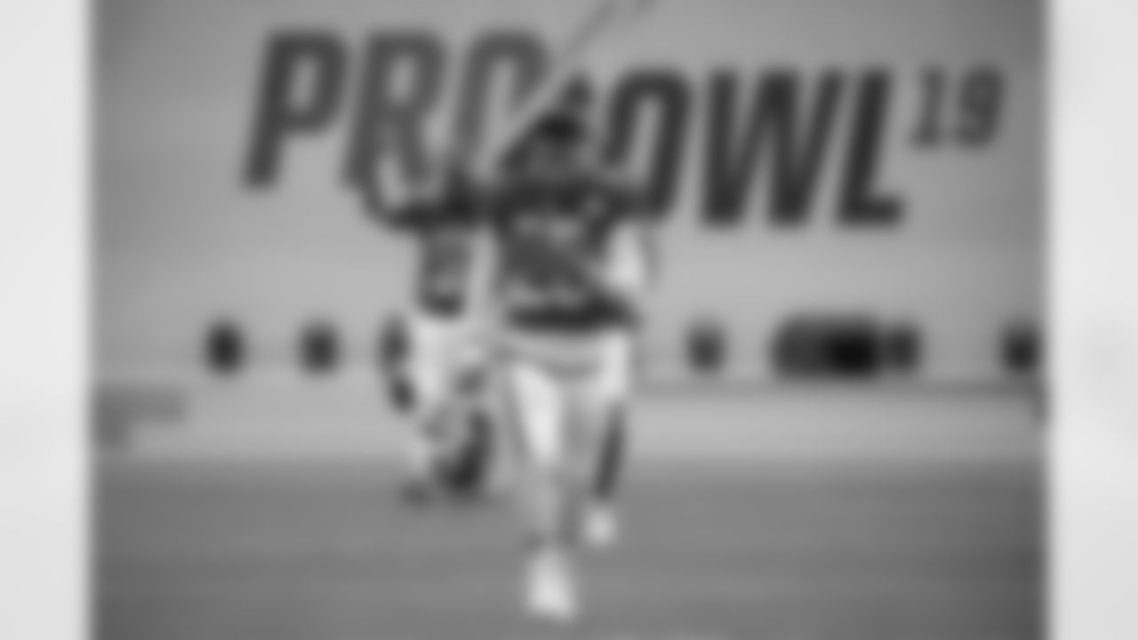 NFC running back Saquon Barkley (26), of the New York Giants, runs onto the field during player introductions before the NFL Pro Bowl football game against the AFC Sunday, Jan. 27, 2019, in Orlando, Fla. (AP Photo/Phelan M. Ebenhack)