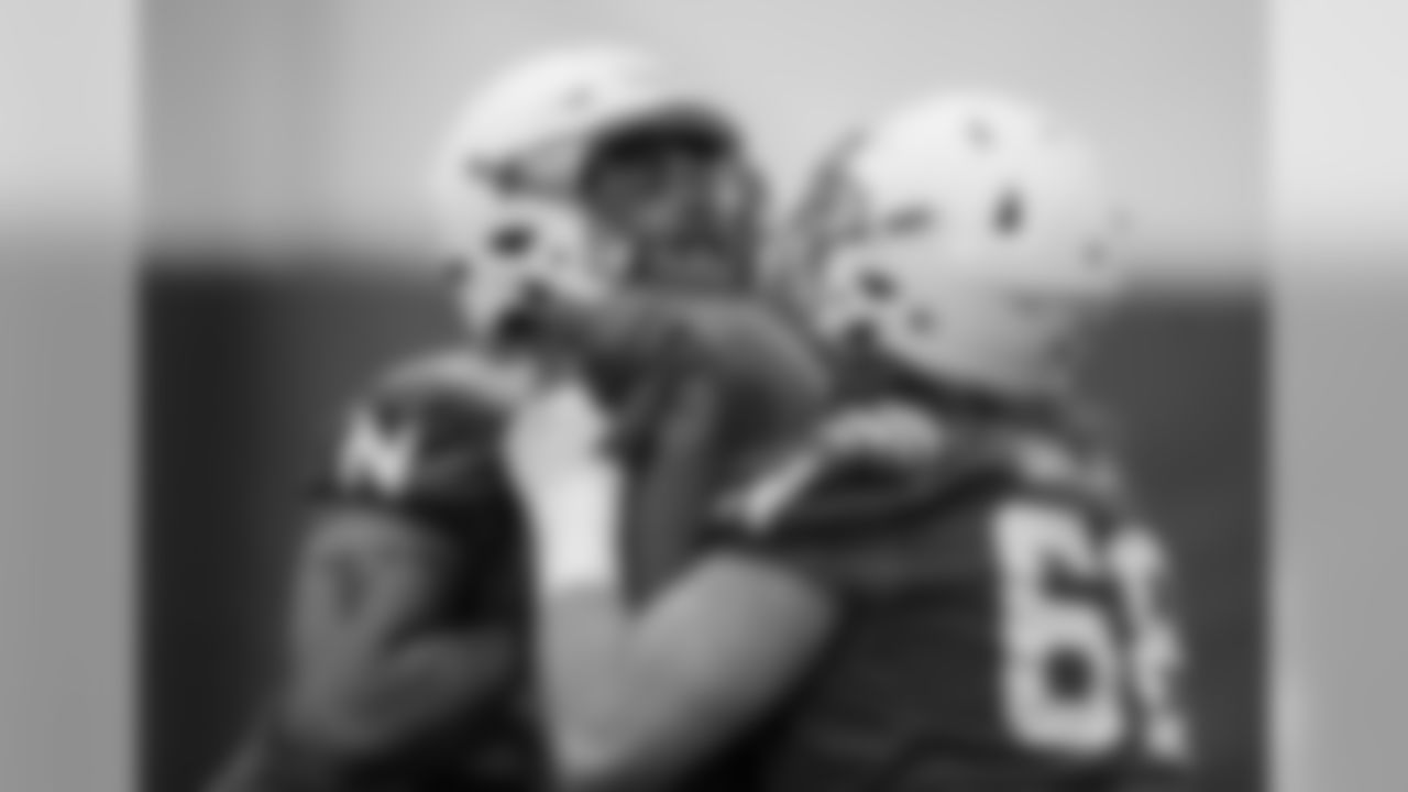 Nebraska offensive lineman Dwayne Johnson Jr. (76) works with offensive lineman Nick Gates (68) during NCAA college football spring practice in Lincoln, Neb., Tuesday, March 8, 2016. (AP Photo/Nati Harnik)