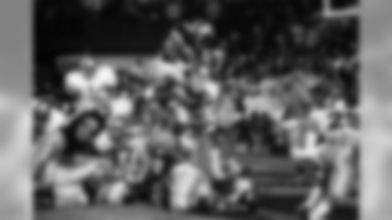Colorado's Eric Bieniemy leaps over a pileup of players for a touchdown. He was stopped short of the goal by Notre Dame in the second quarter of the Orange Bowl Monday night, Jan. 1, 1990 in Miami.(AP Photo/Todd Eddick)