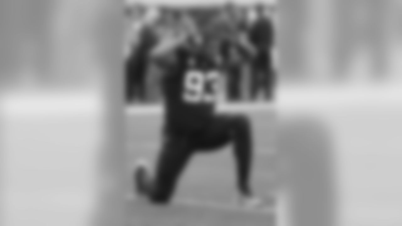 Jacksonville Jaguars defensive end Calais Campbell flexes for TV cameraman as he warms up before an NFL football game against the Los Angeles Chargers, Sunday, Dec. 8, 2019, in Jacksonville, Fla. (AP Photo/John Raoux)