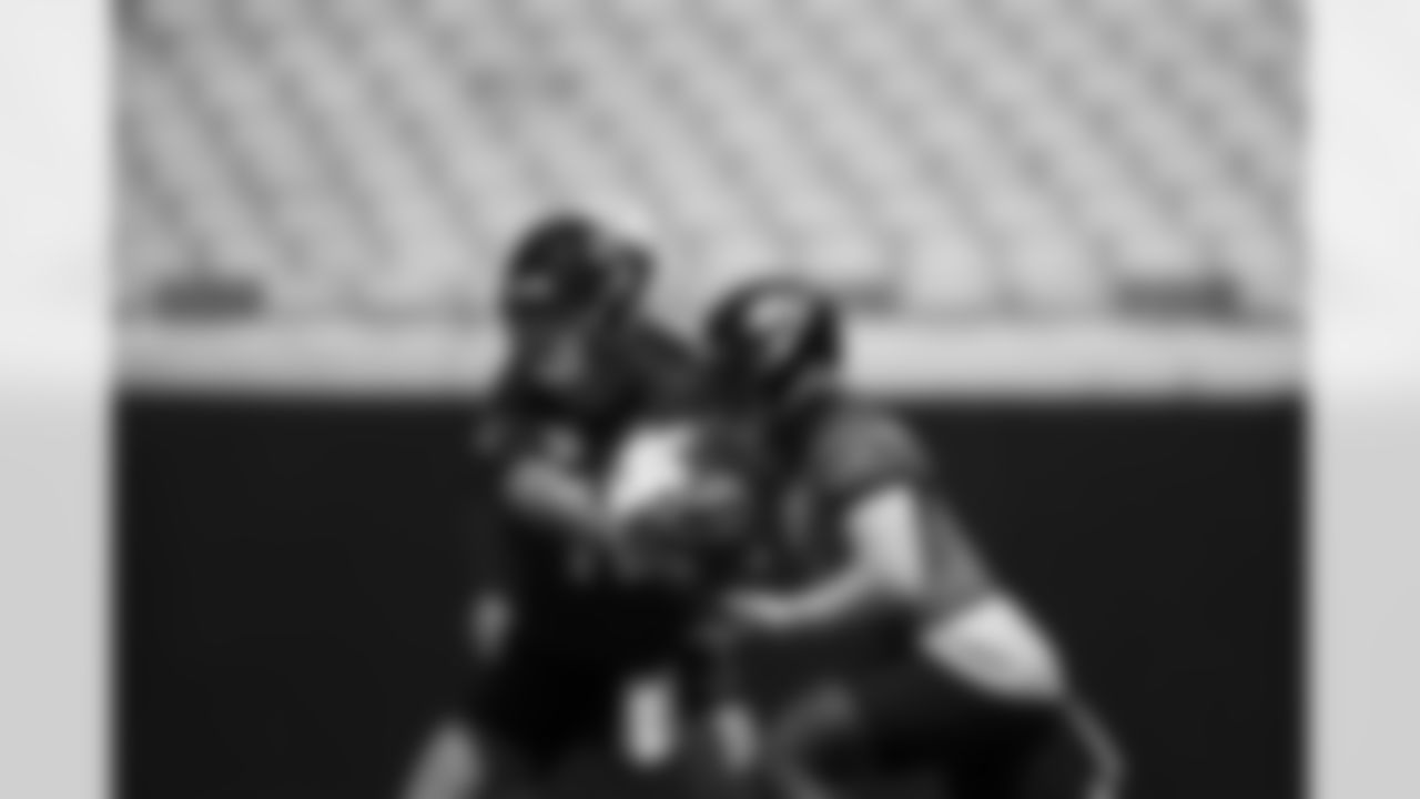 Jacksonville Jaguars quarterback Trevor Lawrence (16) and Travis Etienne Jr. (1) during OTAs at TIAA Bank Field in Jacksonville, FL on May 29, 2023. (Kam Nedd/Jacksonville Jaguars)