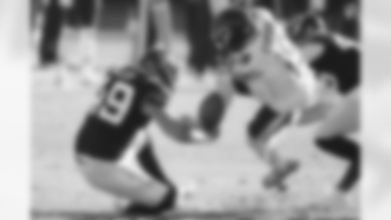 Jacksonville Jaguars fullback Bruce Miller (49) separates Chicago Bears punt returner DeAndre Carter (19) from the football during an NFL football game, Sun, Dec. 27, 2020 in Jacksonville, Fla.