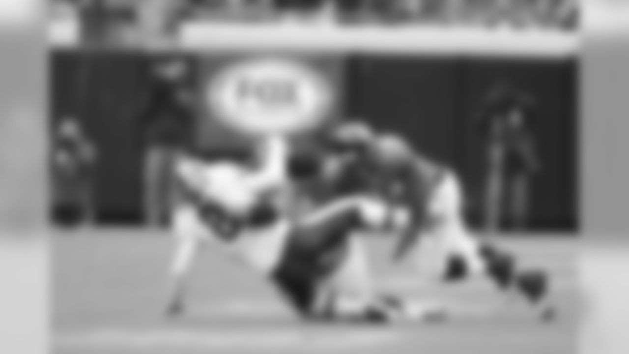 93 Tyson Alualu, #94 Jeremy Mincey