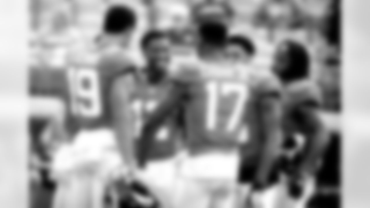 Jacksonville Jaguars wide receiver D.J. Chark (17) jokes with Jacksonville Jaguars wide receiver Dede Westbrook, center, and other receivers before the start of an NFL preseason football game against the Atlanta Falcons, Saturday, Aug. 25, 2018, in Jacksonville, Fla. (AP Photo/Stephen B. Morton)
