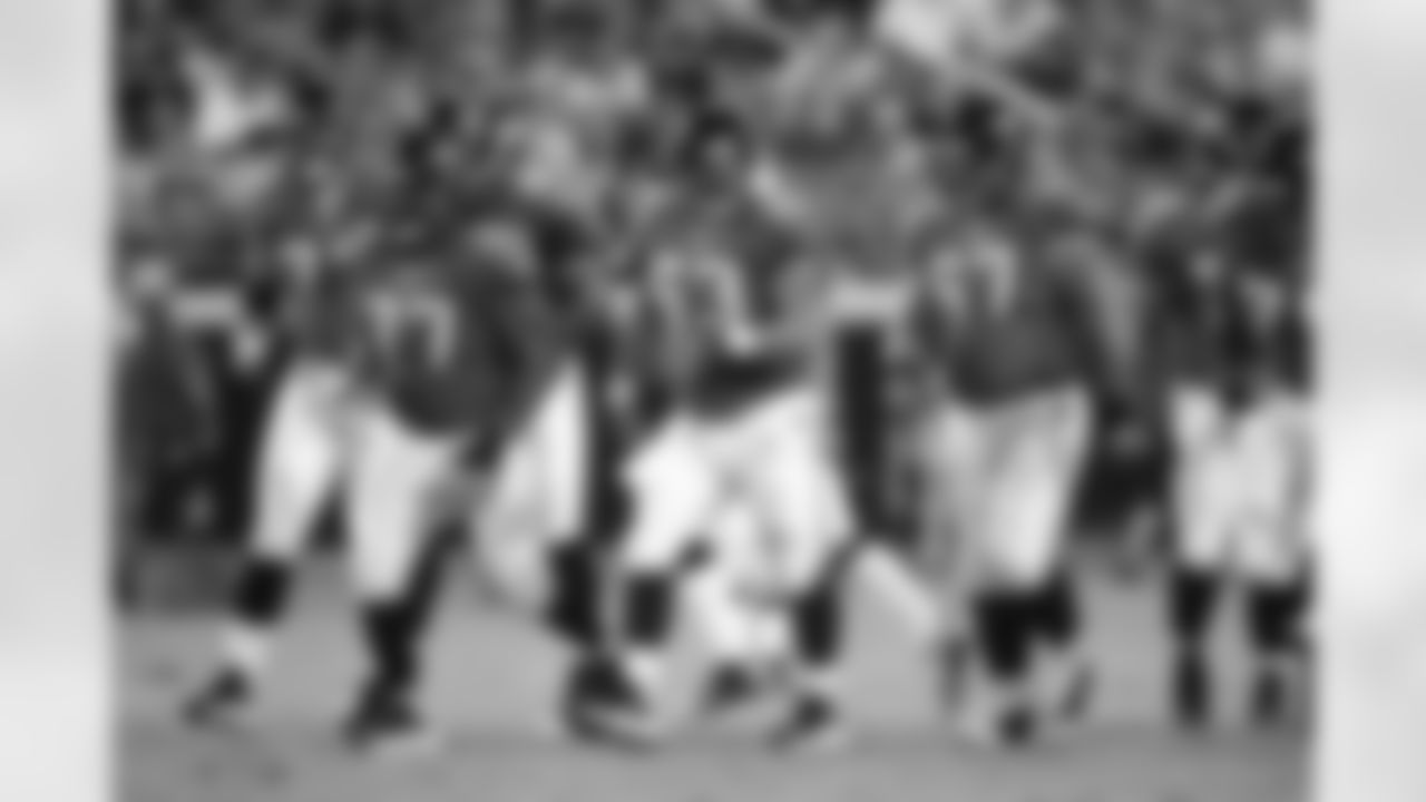 77 Uche Nwaneri, #63 Brad Meester, #67 Vince Manuwai