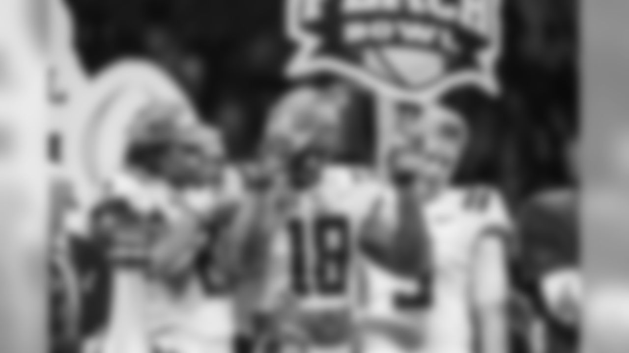 LSU linebacker K'Lavon Chaisson (18) celebrates with teammates after the Peach Bowl NCAA semifinal college football playoff game against Oklahoma, Saturday, Dec. 28, 2019, in Atlanta. (AP Photo/Danny Karnik)