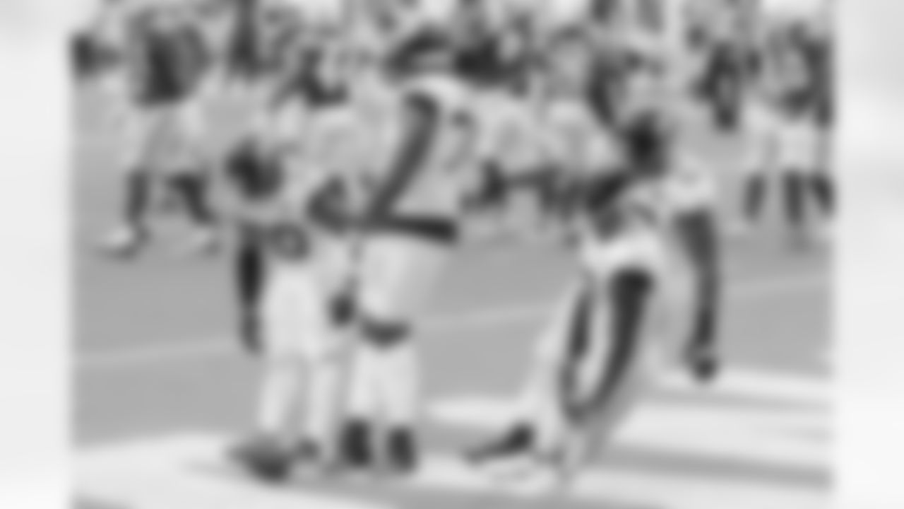 Jacksonville Jaguars players James Robinson (30), Cam Robinson (74), A.J. Cann (60) and DJ Chark Jr. (17) mimic bowling pins being knocked over as they take part in rookie receiver's Laviska Shenault Jr. (not pictured) touchdown celebration with 1:44 to play in the second quarter against the Indianapolis Colts during an NFL football game, Sunday, September 13, 2020 in Jacksonville, Fla.