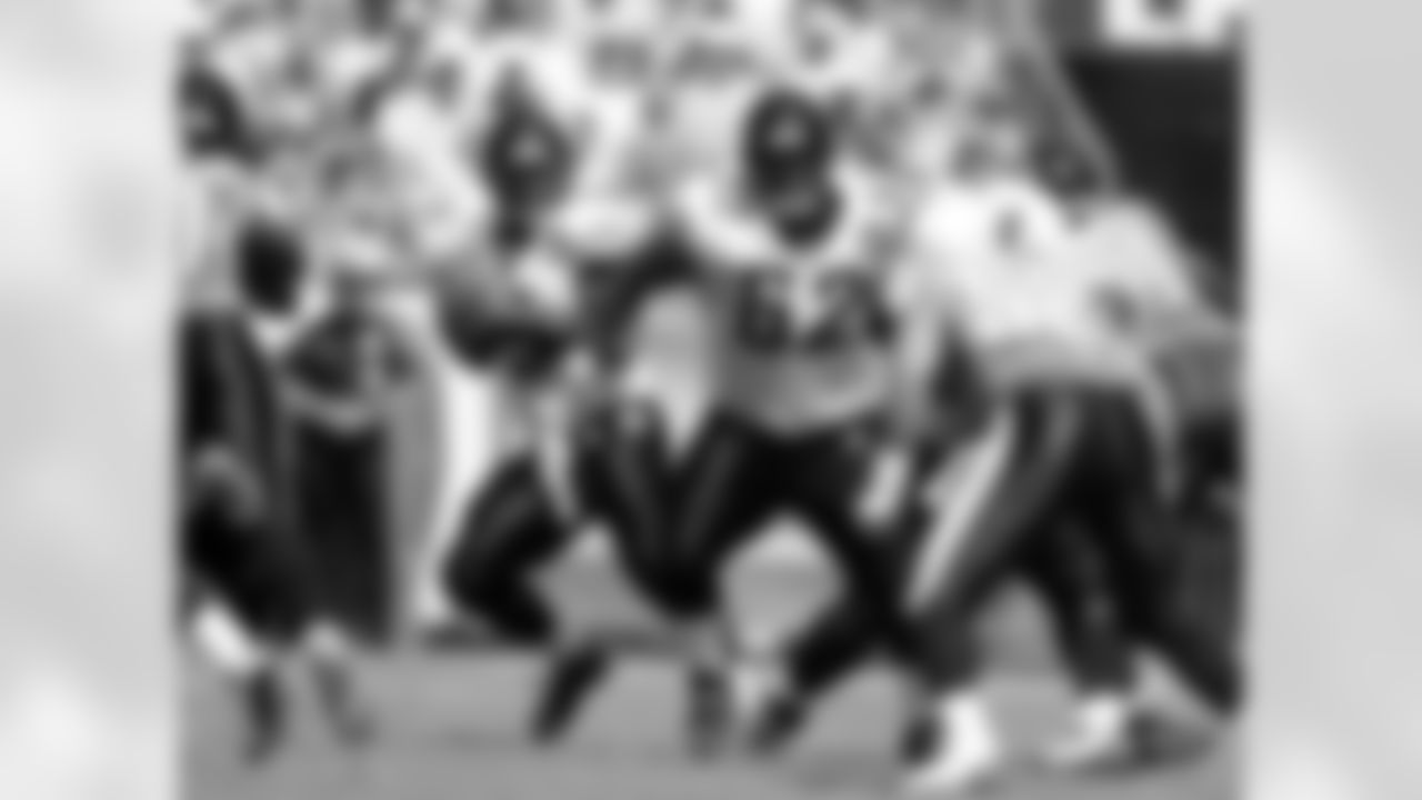 9 David Garrard, #62 Dennis Norman