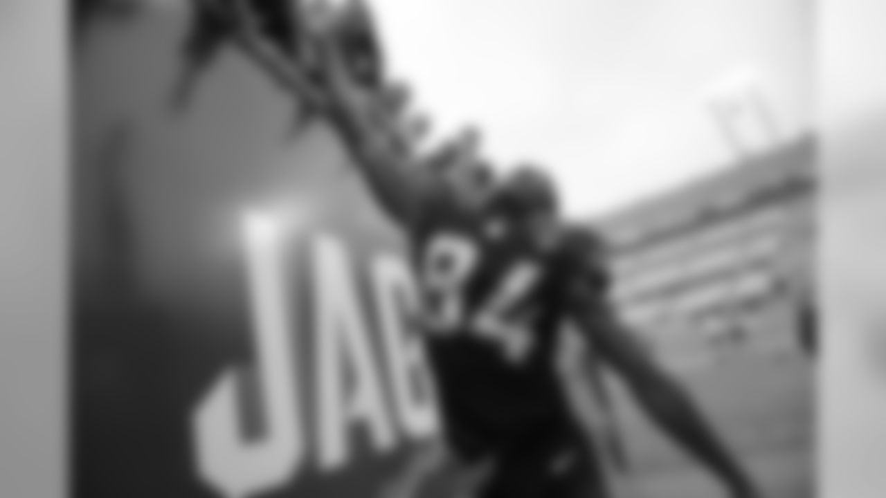 Jacksonville Jaguars wide receiver Keelan Cole (84) slaps hands with fans while walking off the field after an NFL football game against the Indianapolis Colts Sunday, Dec. 3, 2017, in Jacksonville, Fla. The Jaguars won 30-10. (AP Photo/Phelan M. Ebenhack)