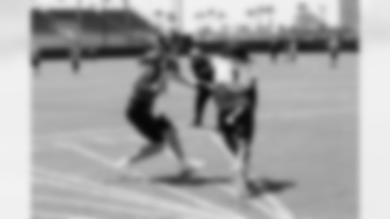 QB Trevor Lawrence (16) and RB Travis Etienne Jr. (1)