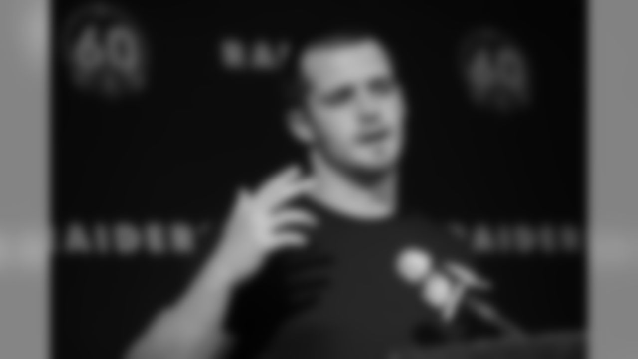 Oakland Raiders quarterback Derek Carr gestures during a news conference at the end of an NFL football game against the Jacksonville Jaguars in Oakland, Calif., Sunday, Dec. 15, 2019. Jacksonville won the game 20-16. (AP Photo/Ben Margot)