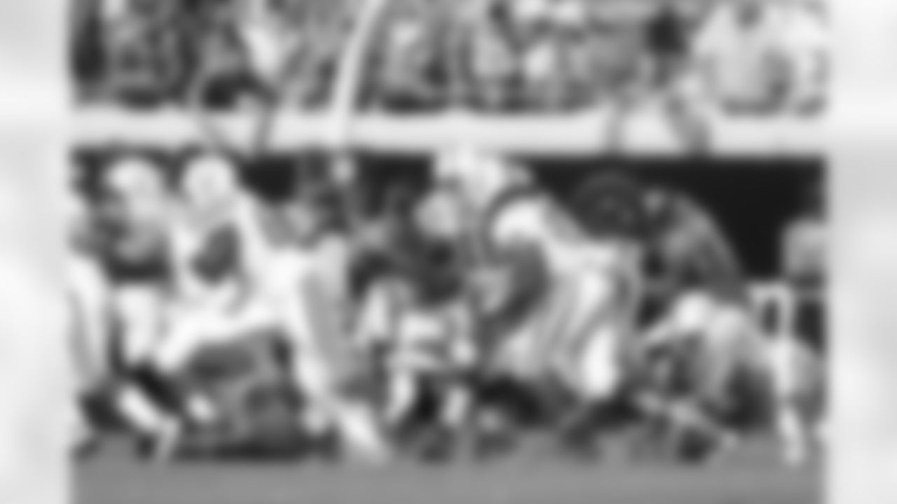 93 Tyson Alualu, #91 Derrick Harvey