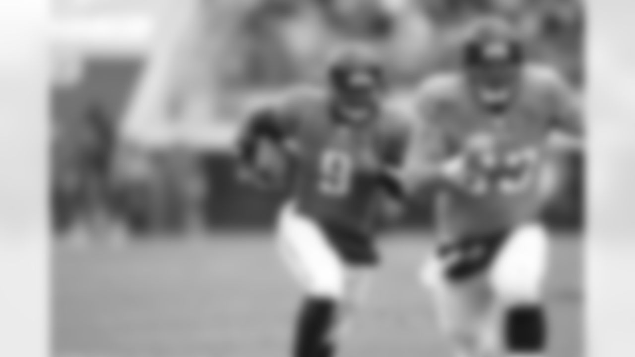 63 Brad Meester, #9 David Garrard