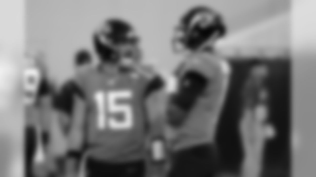 Jacksonville Jaguars quarterback Gardner Minshew (15) and quarterback Joshua Dobbs, right, talk during warm ups before an NFL football game against the Tennessee Titans, Thursday, Sept. 19, 2019, in Jacksonville, Fla. (AP Photo/John Raoux)