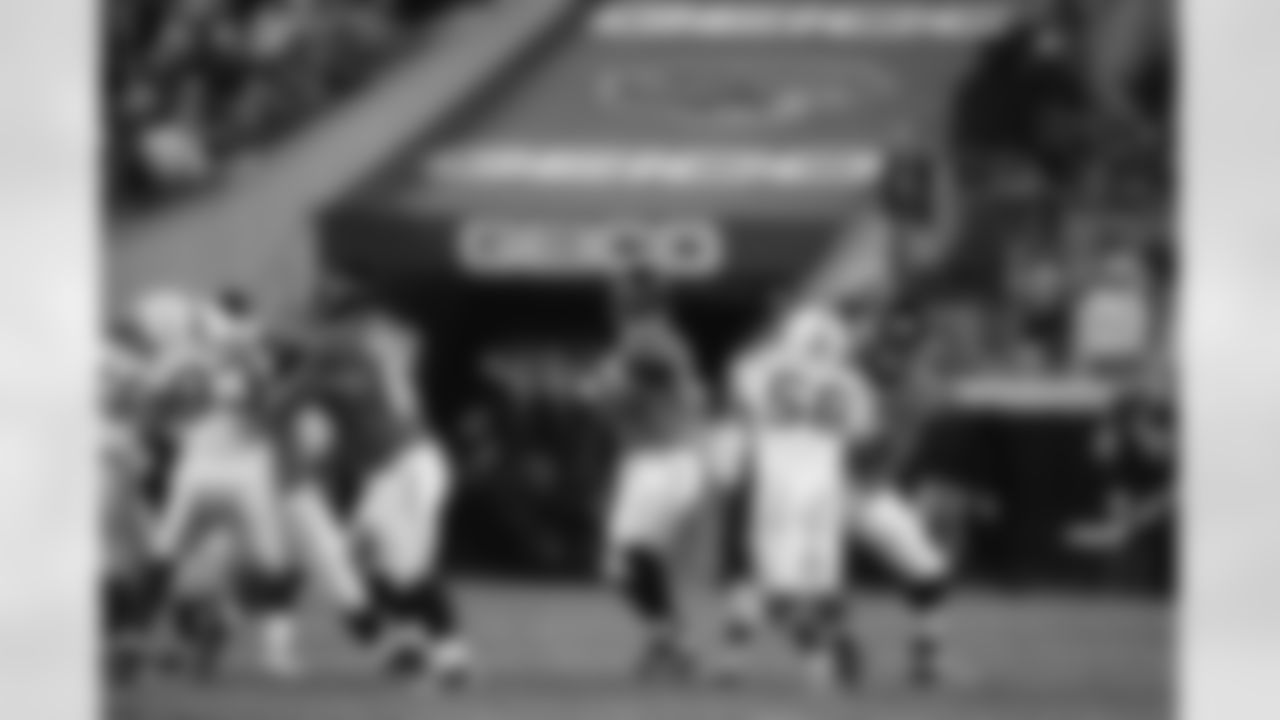 63 Brad Meester, #9 David Garrard