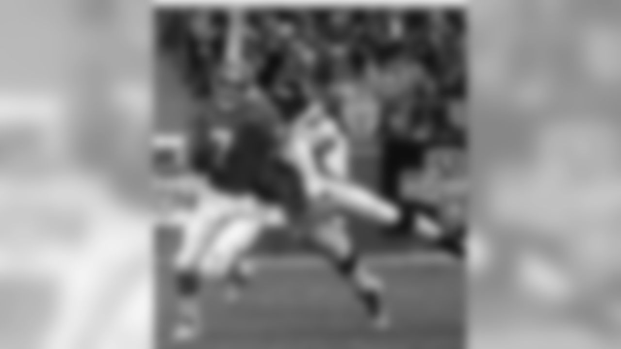 Tony Brackens brings down Broncos QB John Elway, as the Jaguars earn the AFC Divisonal Playoff Game win in Denver, 30-27.