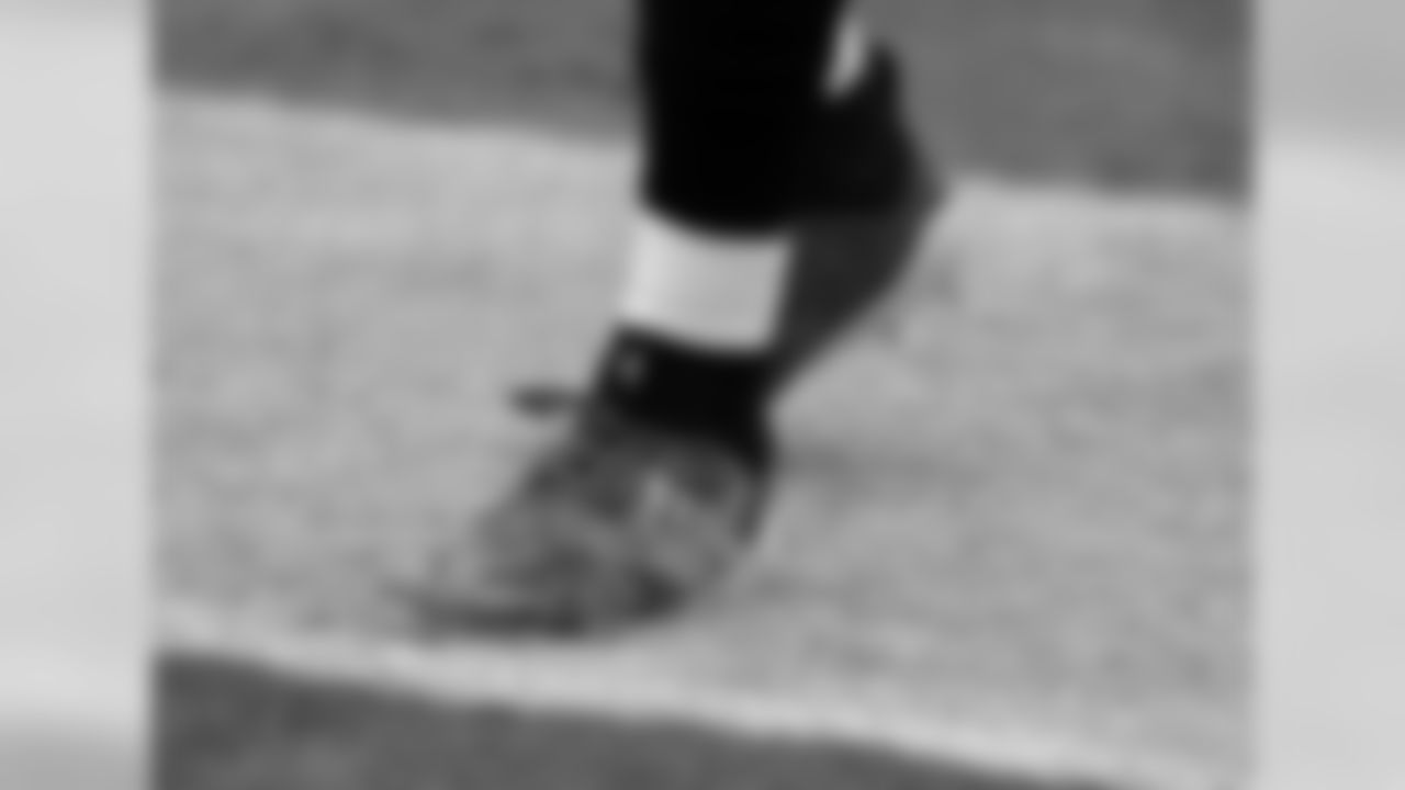 Jacksonville Jaguars defensive end Yannick Ngakoue wears cleats supporting a cause before the first half of an NFL football game against the Indianapolis Colts, Sunday, Dec. 2, 2018, in Jacksonville, Fla. (AP Photo/John Raoux)