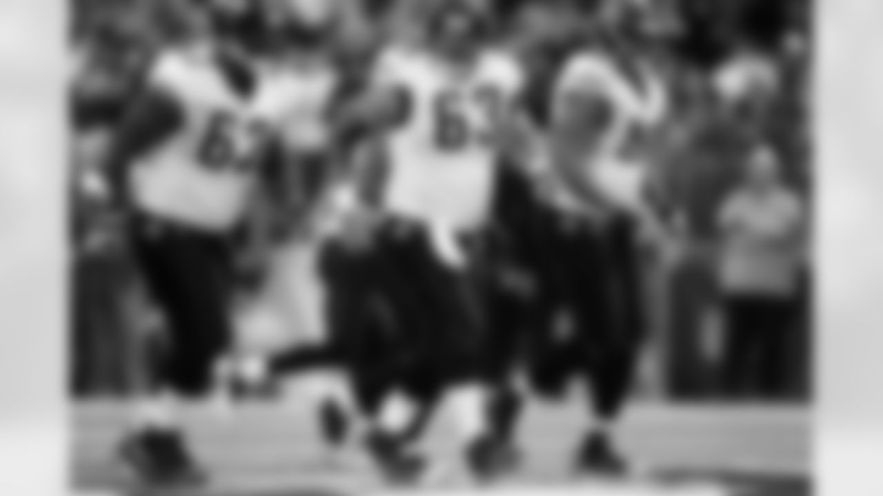 62 Dennis Norman, #63 Brad Meester, #69 Khalif Barnes