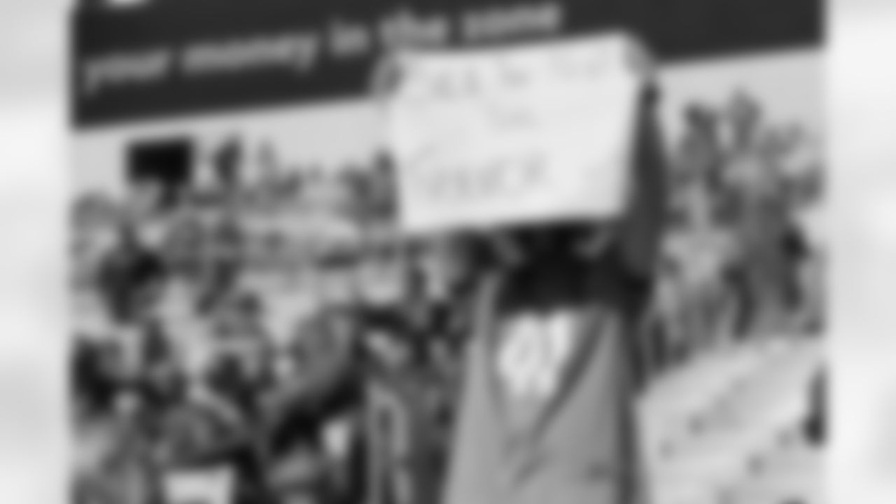 A Jacksonville Jaguars fan holds up a sign in reference to the Jags securing the number one pick in next year's NFL Draft against the Chicago Bears during an NFL football game, Sun, Dec. 27, 2020 in Jacksonville, Fla.