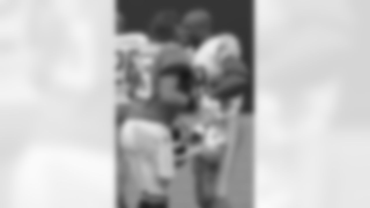 Jacksonville Jaguars quarterback Gardner Minshew II (15) receives a hug from Detroit Lions running back Adrian Peterson (28) following an NFL football game, Sunday, Oct. 18, 2020 in Jacksonville, Fla.