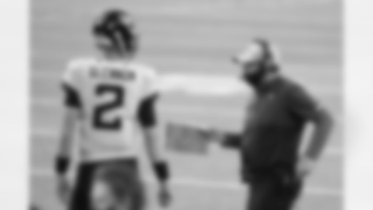 Jacksonville Jaguars uqrtareback Mike Glennon (2) conferes with offensive coordinator Jay Gruden before a two-point conversion attempt with 1:08 to play in the fourth quarter against the Minnesota Vikings during an NFL football game, Sunday, Dec. 6, 2020 in Minneapolis, Mn.