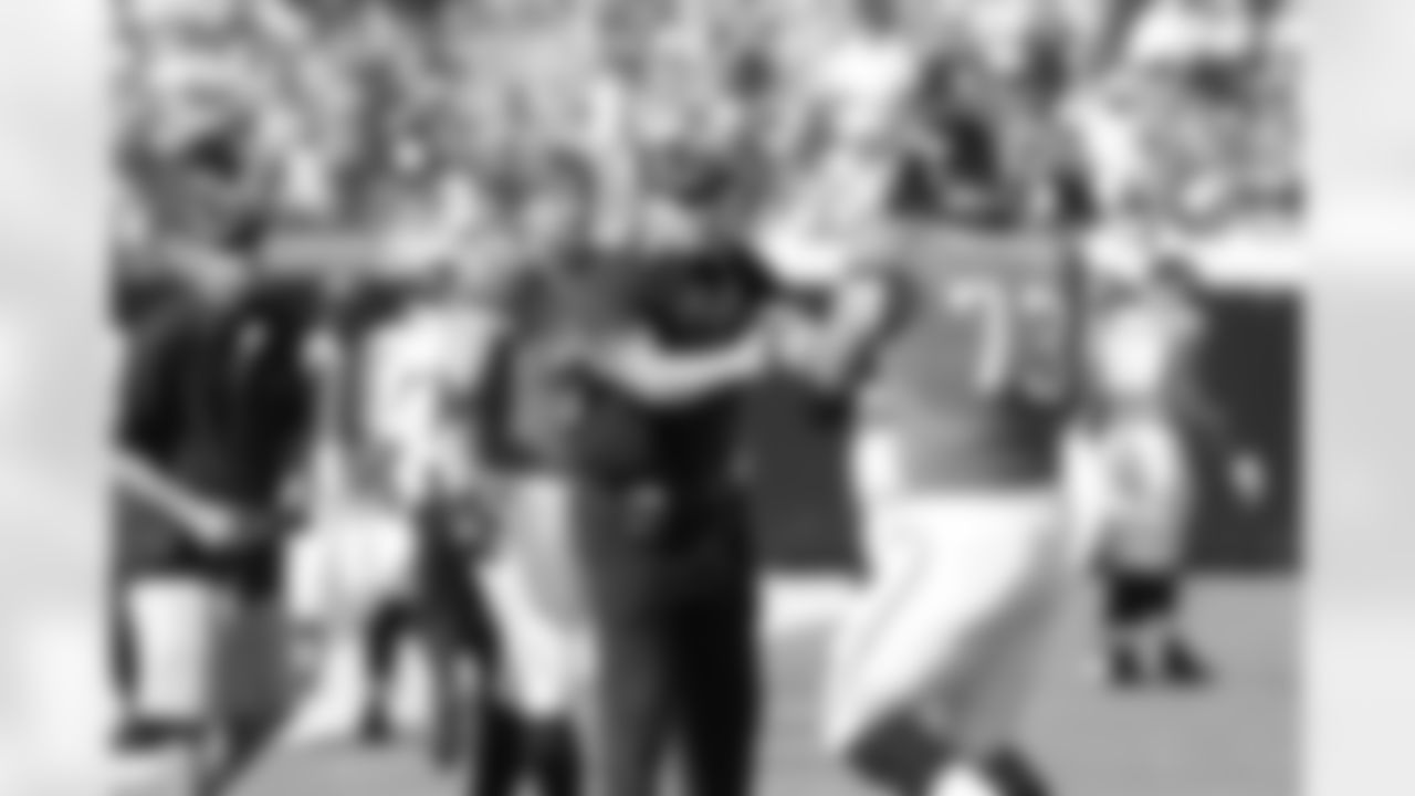 Jack Del Rio, #73 Eben Britton