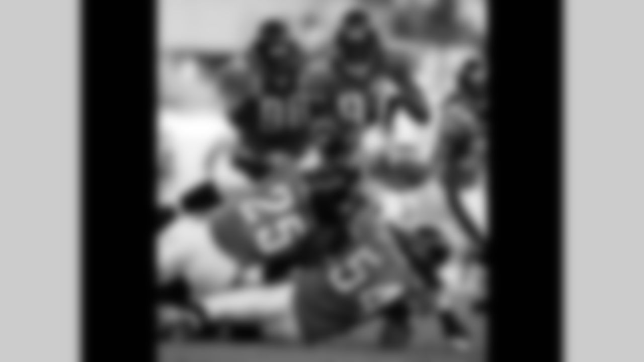 98 John Henderson, #97 Reggie Hayward, #25 Reggie Nelson, #54 Mike Peterson