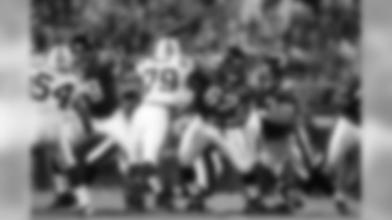 79 Tony Pashos, #62 Dennis Norman, #63 Brad Meester